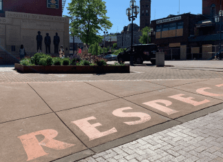 The word respect is displayed in concrete on the memorial square.